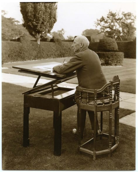 Nathaniel Lloyd and his Architect table on the front lawn at Great Dixter