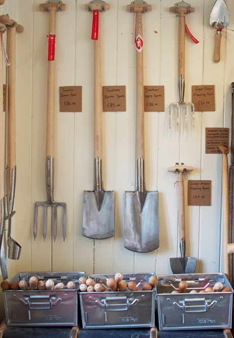 Large tools for sale in the shop at Great Dixter